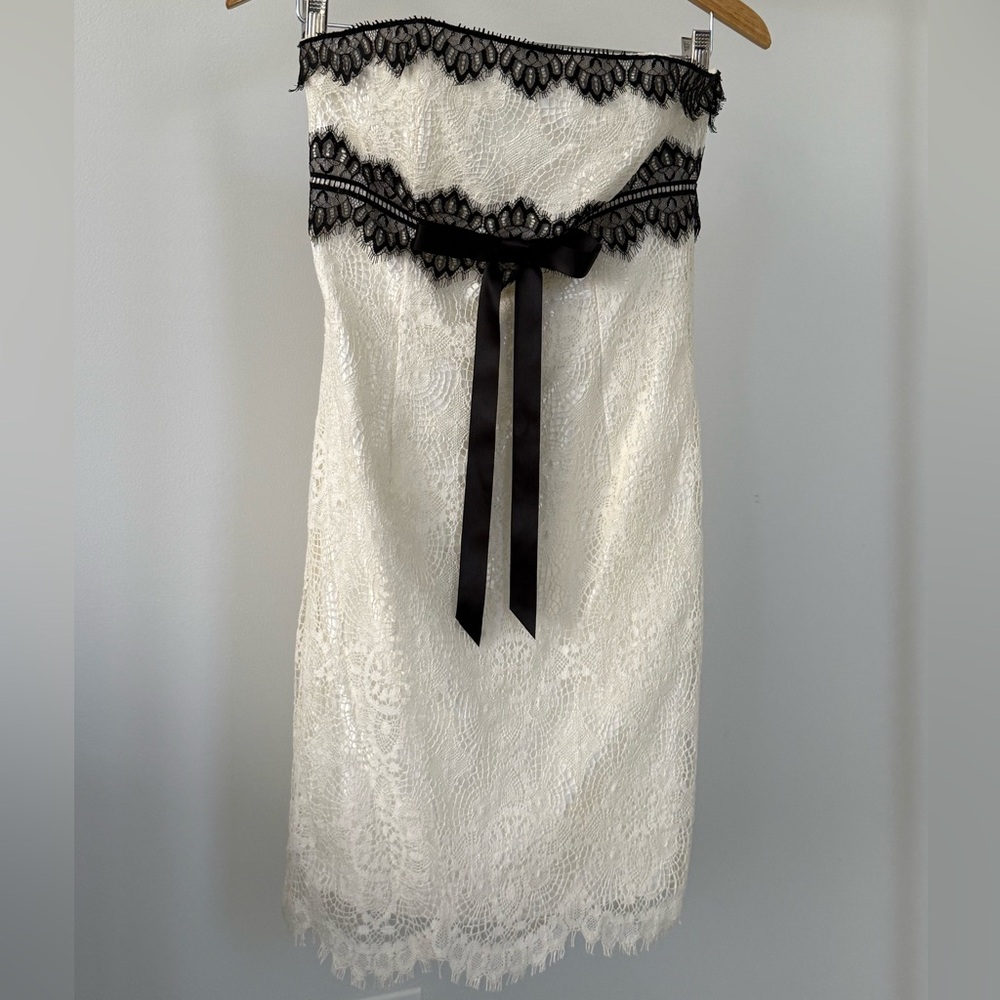 Strapless cream and black lace knee length dress